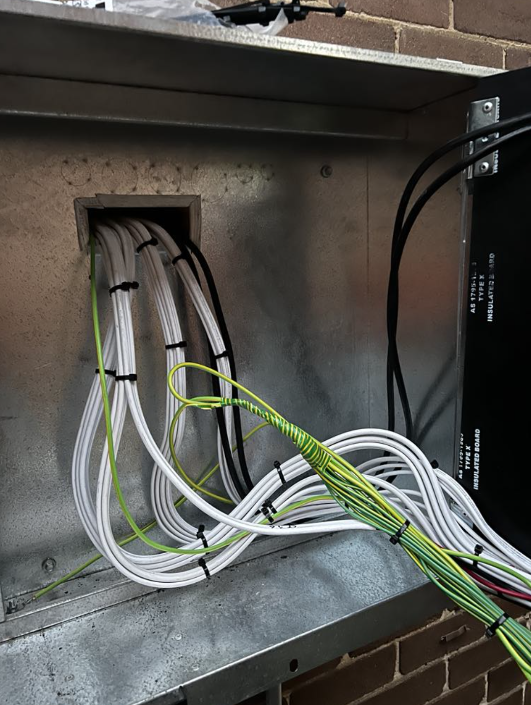 Neat mains cabling into the meter enclosure